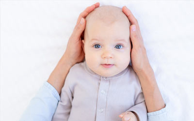 Flat Head Syndrome (Plagiocephaly): Causes, Prevention & When to Seek Help
